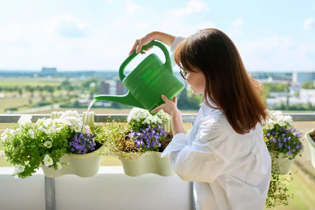 woman-watering-her-plants-1024x683.jpg